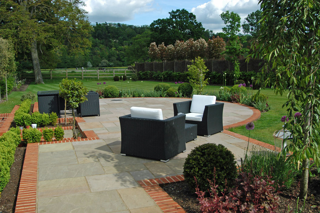 Curved terrace set amongst planting